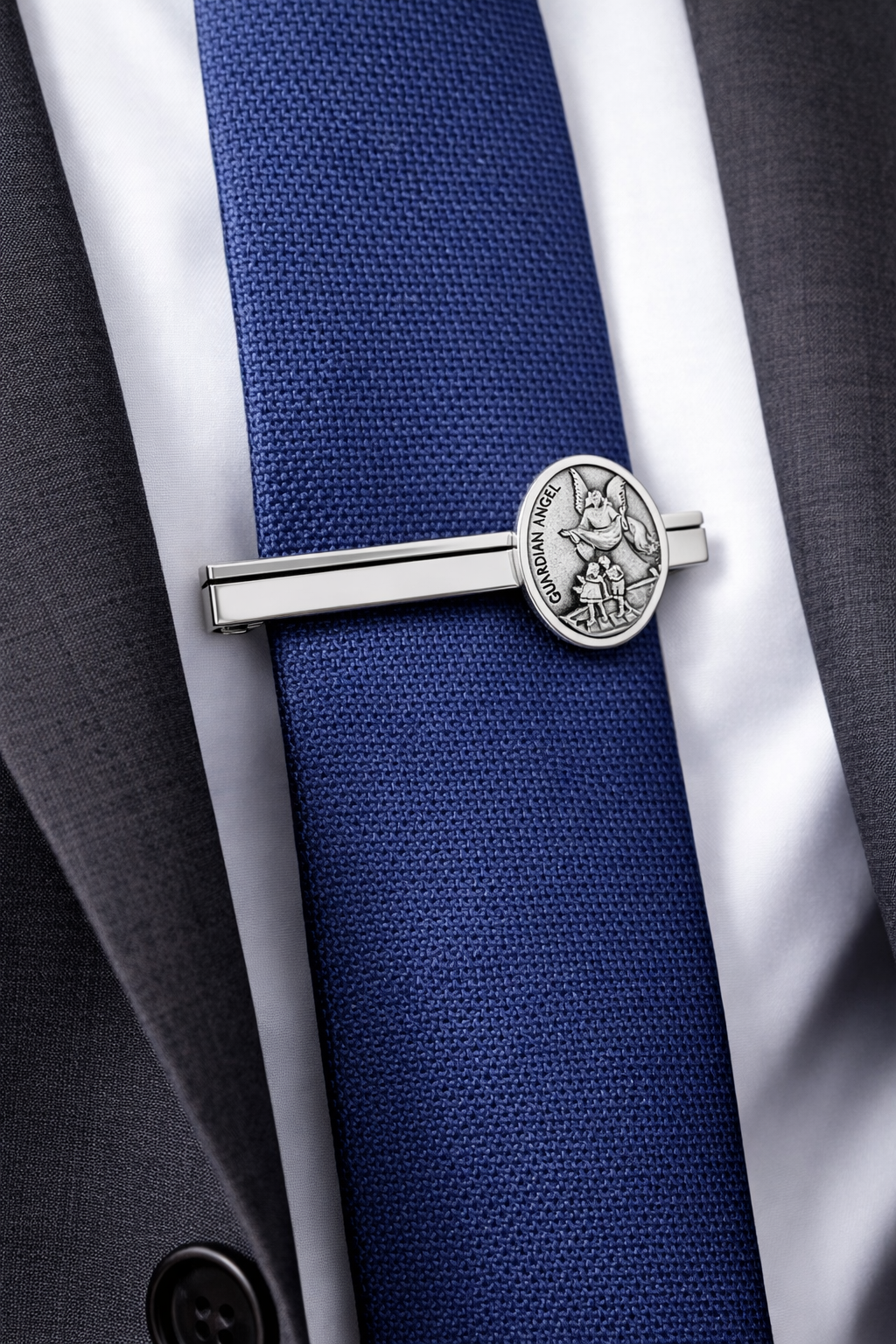 Blue tie with a silver tie clip on a suit and shirt background