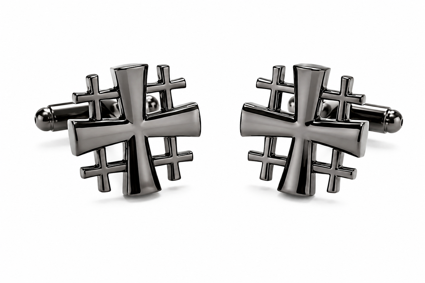 A pair of men's cufflinks featuring a polished dark metallic cross design layered over a geometric grid pattern, set against a clean white background.