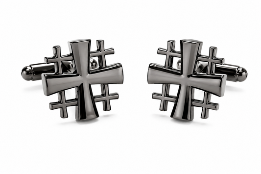 A pair of men's cufflinks featuring a polished dark metallic cross design layered over a geometric grid pattern, set against a clean white background.
