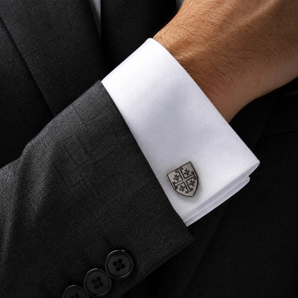 Gunmetal Jerusalem Cross shield cufflink worn with charcoal suit