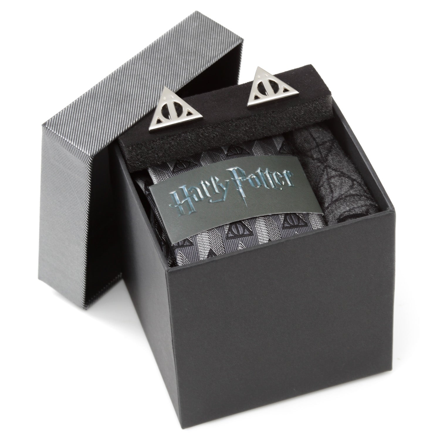 Black jewelry box with 'Harry Potter' branding containing silver earrings.