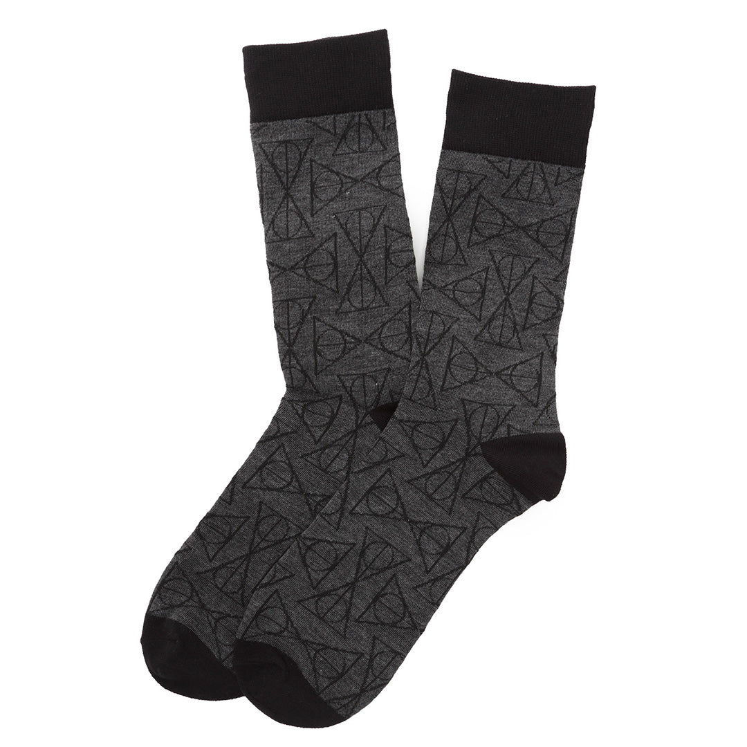 Pair of gray socks with black geometric pattern on a white background