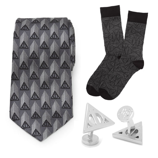 Gray tie with black triangle pattern, matching socks, and two silver tie clips on a white background