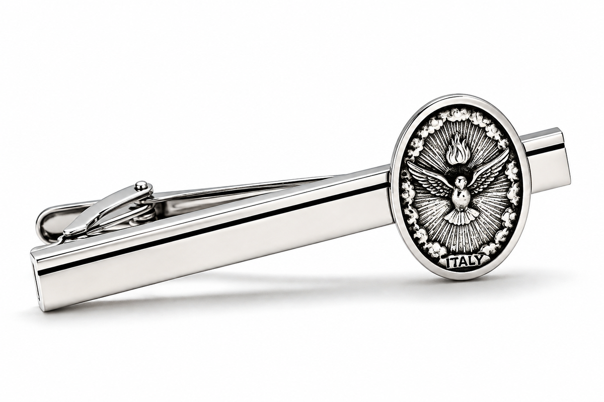 A silver-toned tie clip featuring an oval medallion with an embossed dove motif and the word 'ITALY' at the bottom, shown on a clean white background.