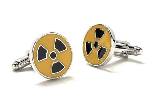 A pair of yellow and black enamel cufflinks with a radioactive symbol design.
