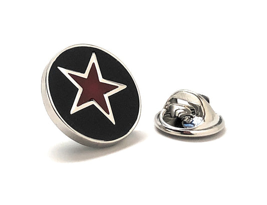 Black round pin with a red star on a white background