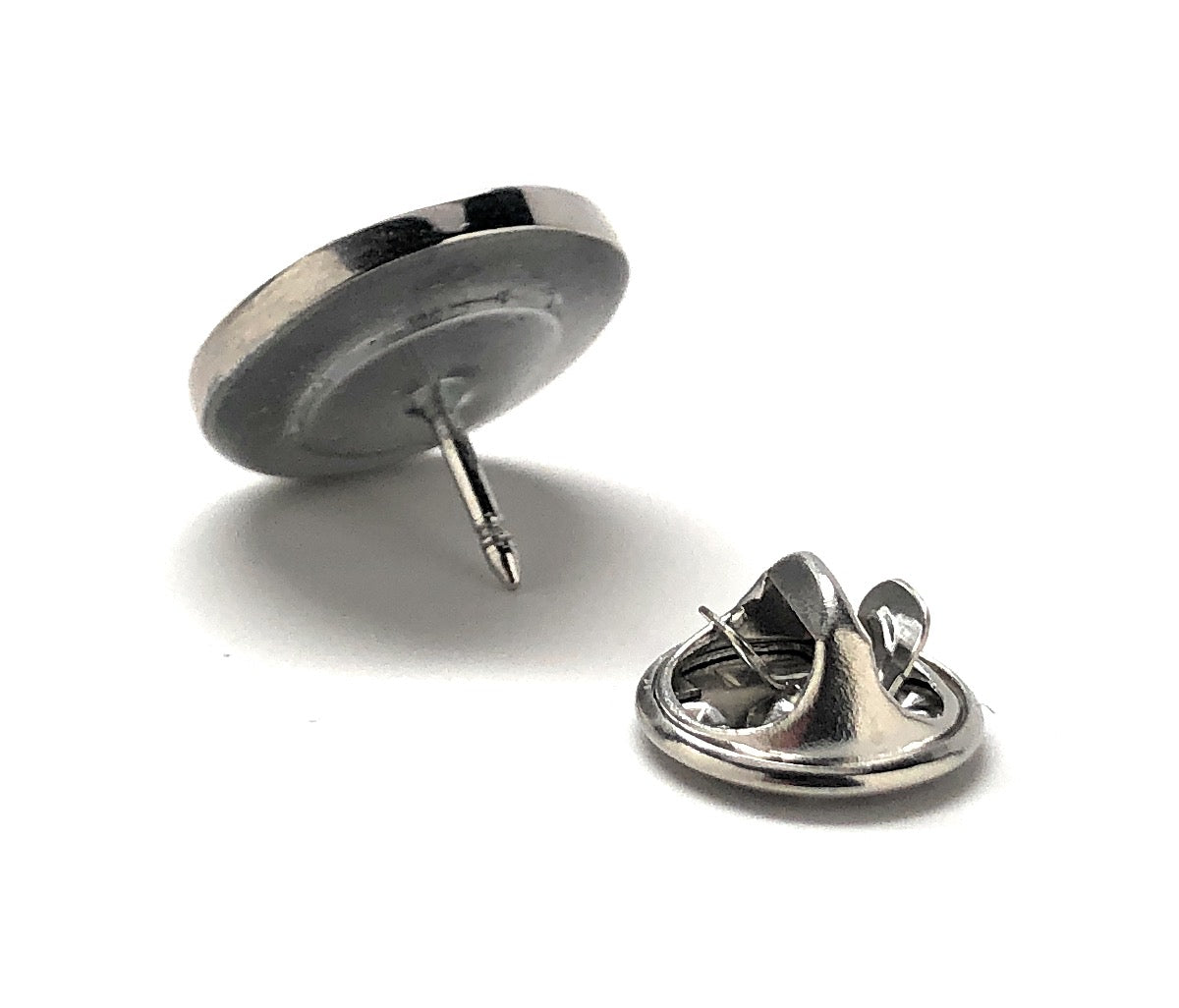 Two metal pins on a white background