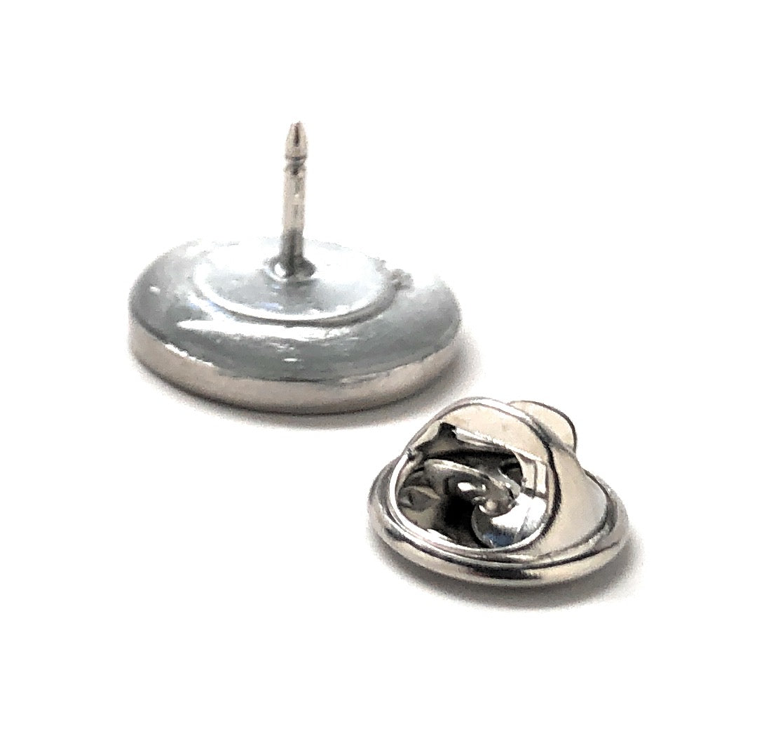 Metallic pushpin on a white background