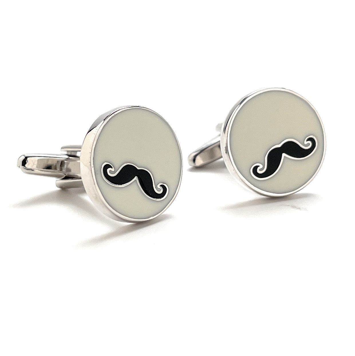 Cufflinks with mustache design on a white background