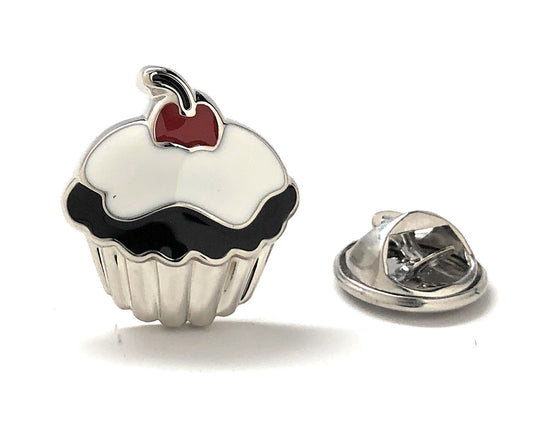 Cupcake-shaped lapel pin with a cherry on top on a white background