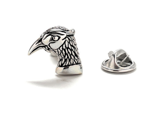 Silver bird-shaped lapel pin on a white background
