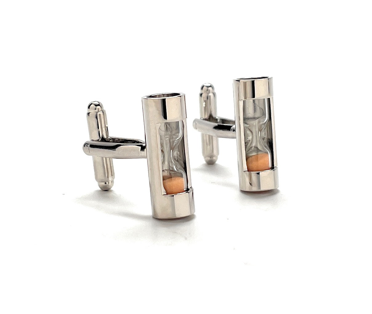 Silver cufflinks with a central cylindrical design on a white background