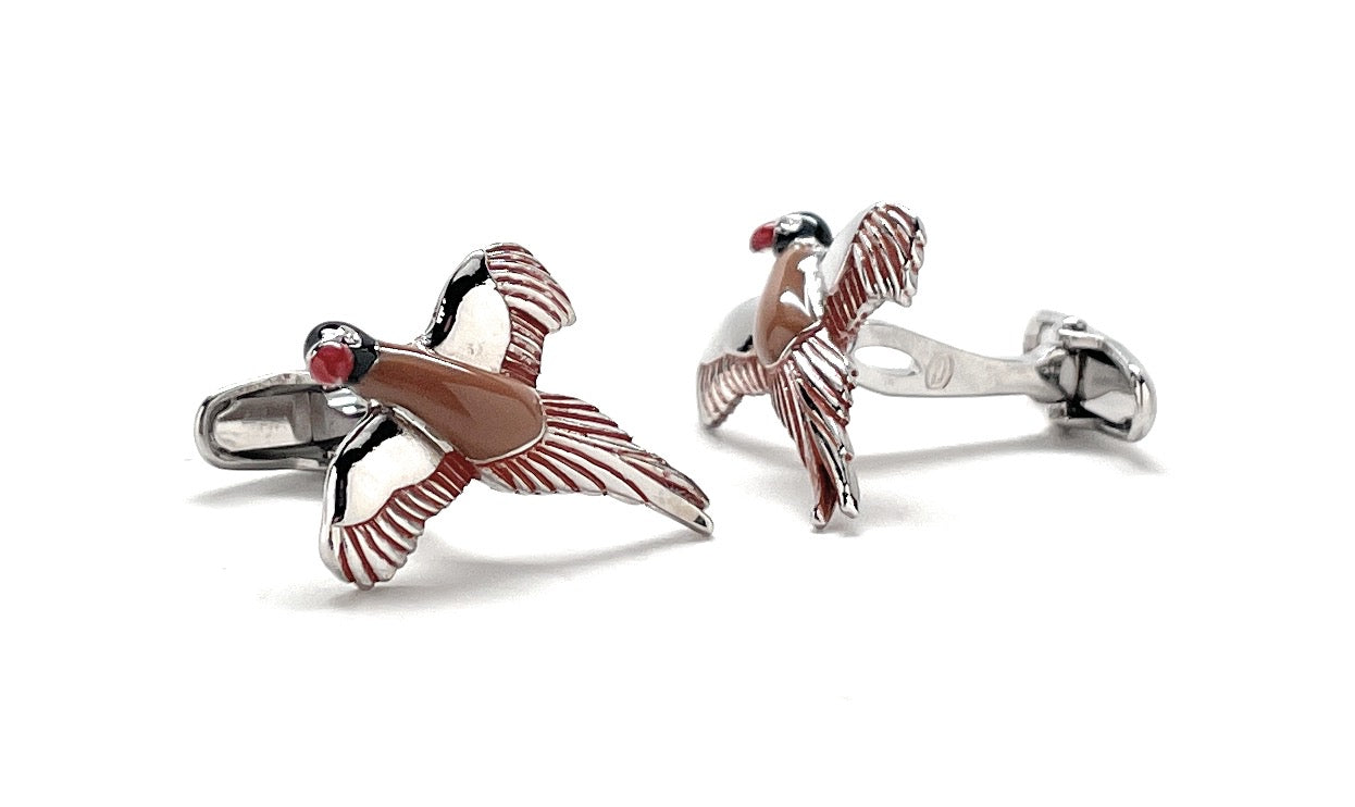 Pair of bird-shaped cufflinks on a white background
