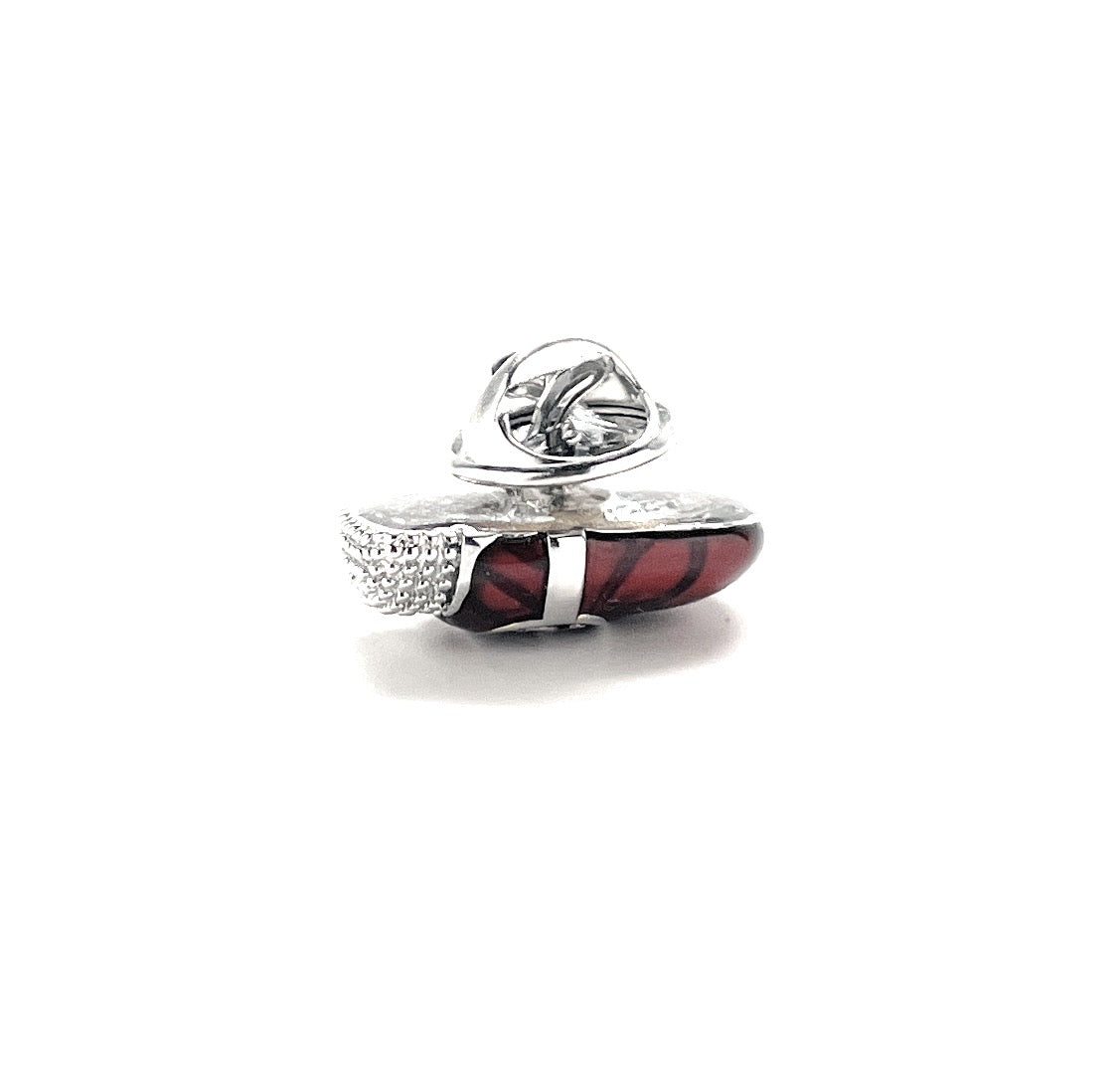 Silver ring with red gemstone on a white background