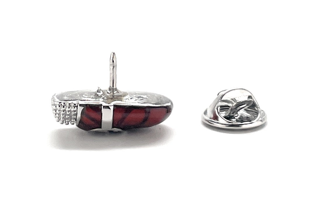 Silver ring with red stone on a white background