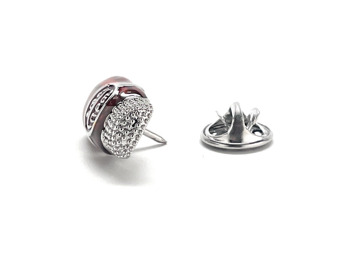 Silver earring with clear gemstones on a white background