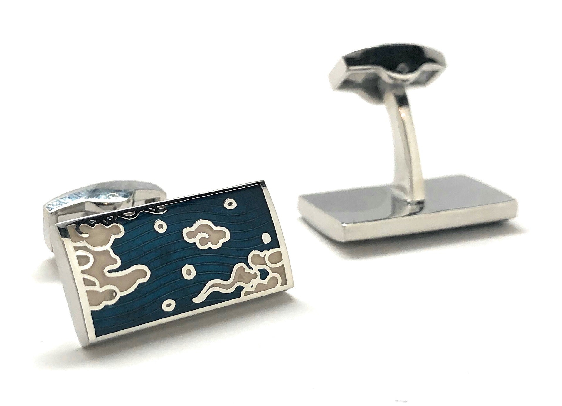 Cufflinks with a blue design on a white background