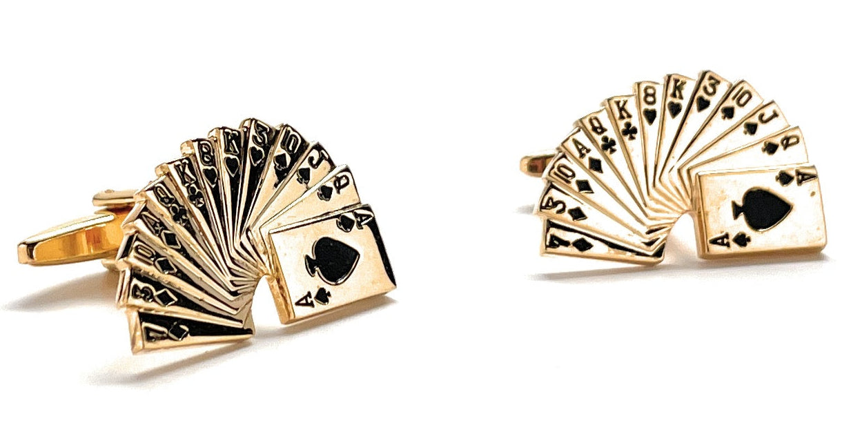 Gold playing card suit cufflinks on a white background