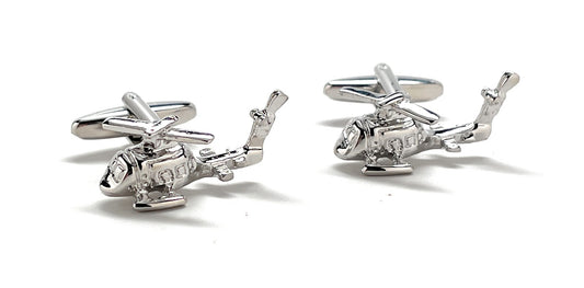 Helicopter-shaped cufflinks on a white background