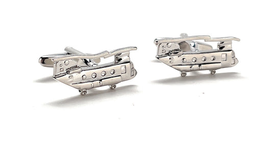 Silver helicopter cufflinks on a white background