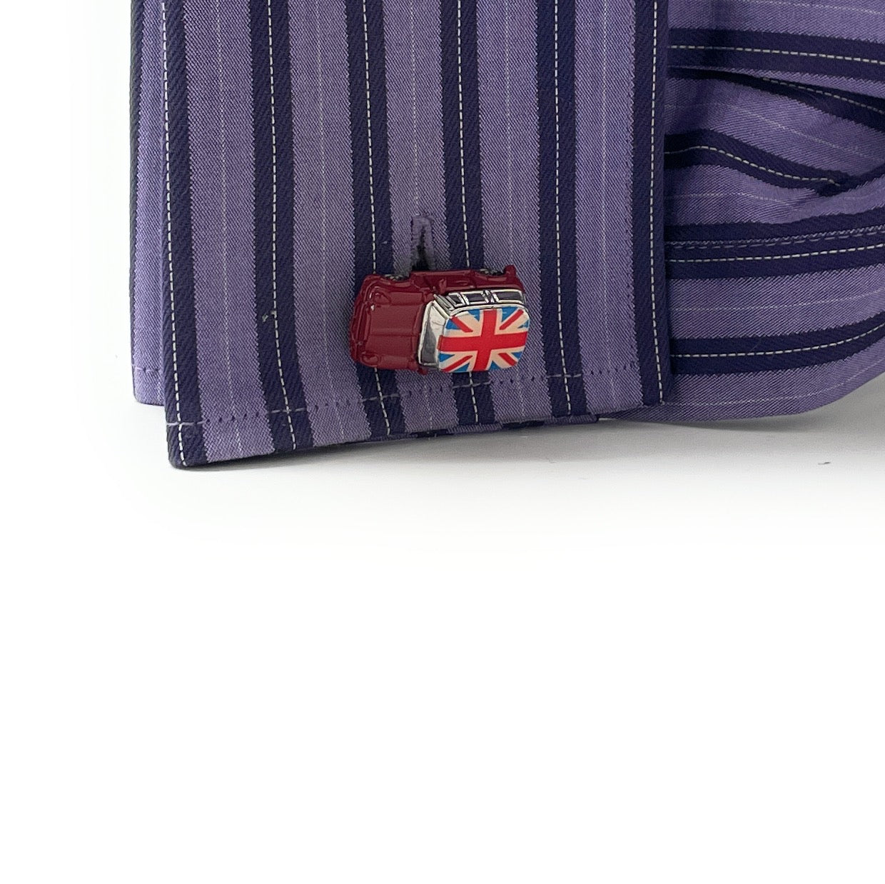 Cufflink with British flag design on a striped shirt cuff