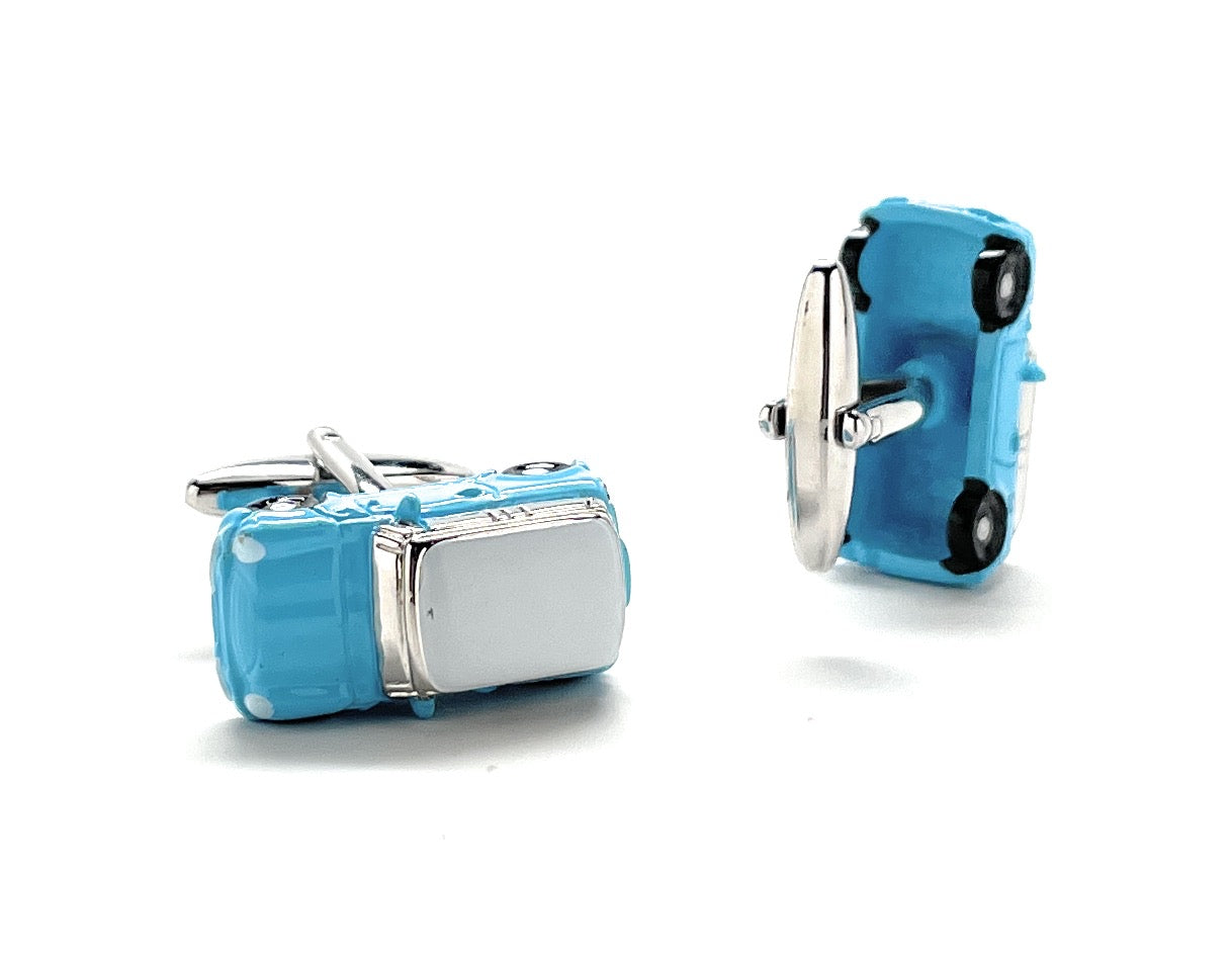 Blue and silver cufflinks on a white background