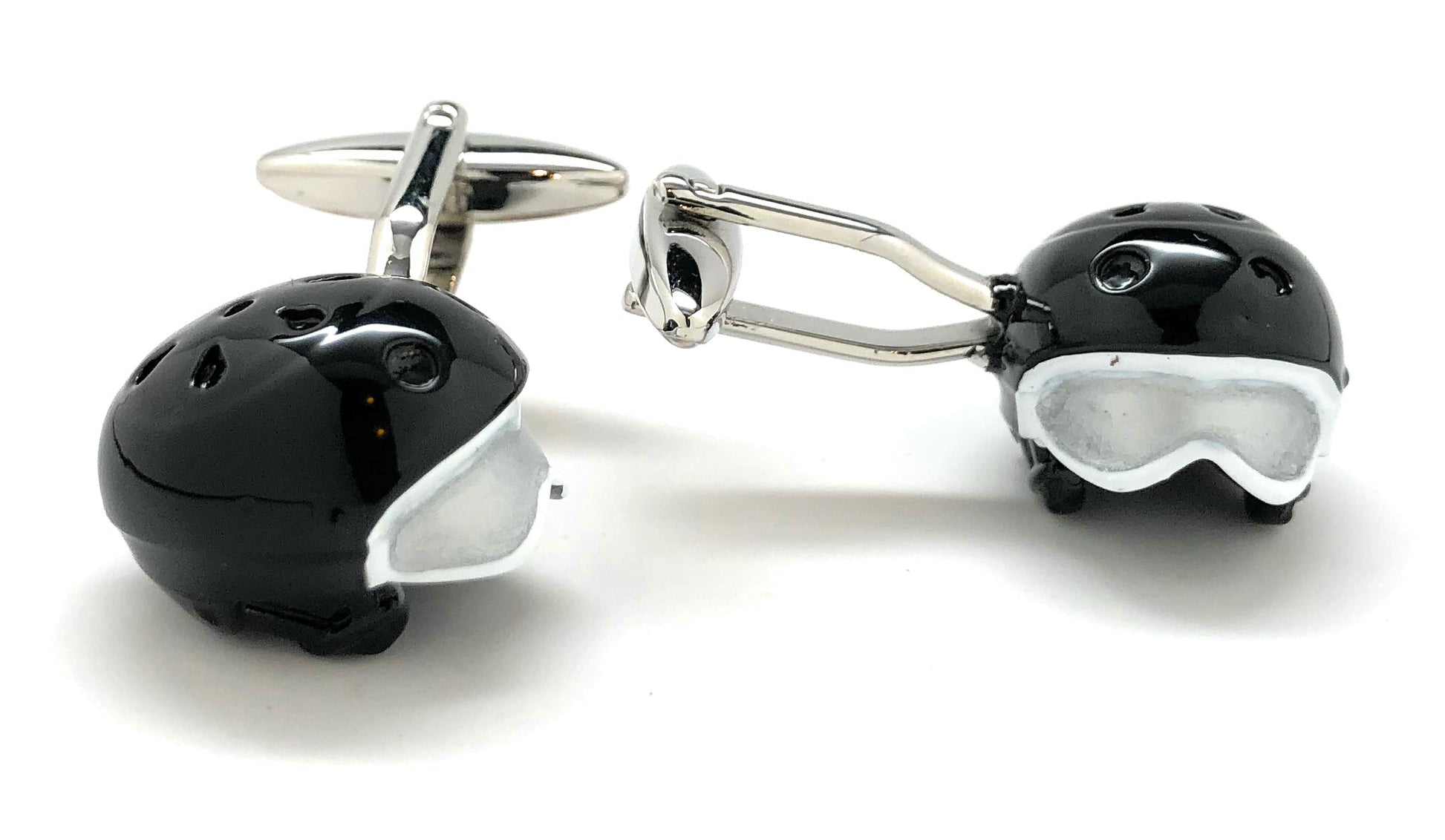 Black helmet and goggles cufflinks on a white background
