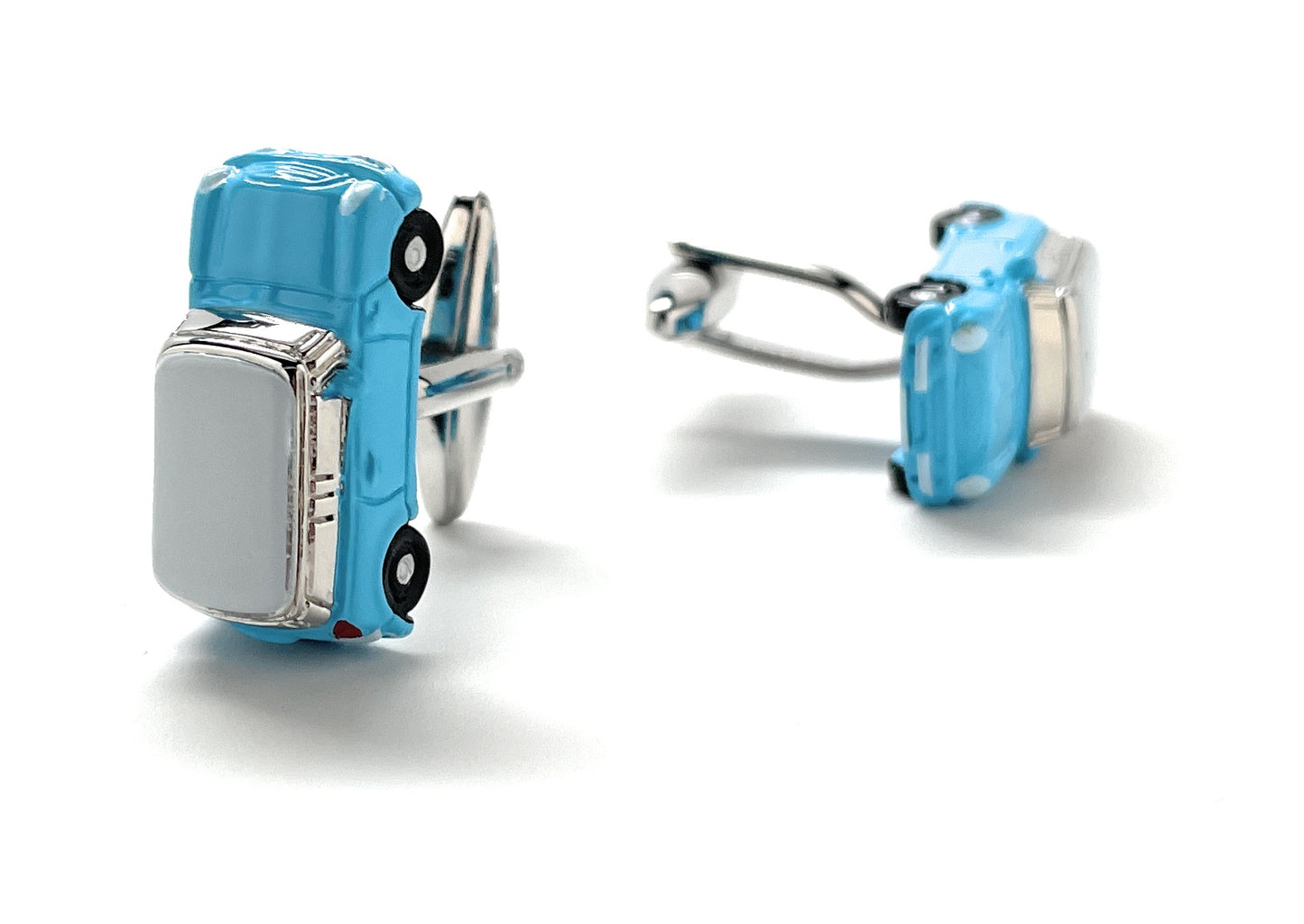 Blue car-shaped cufflinks on a white background