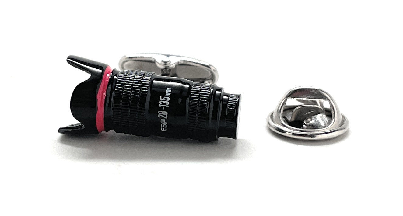 Camera lens with a pink accent on a white background