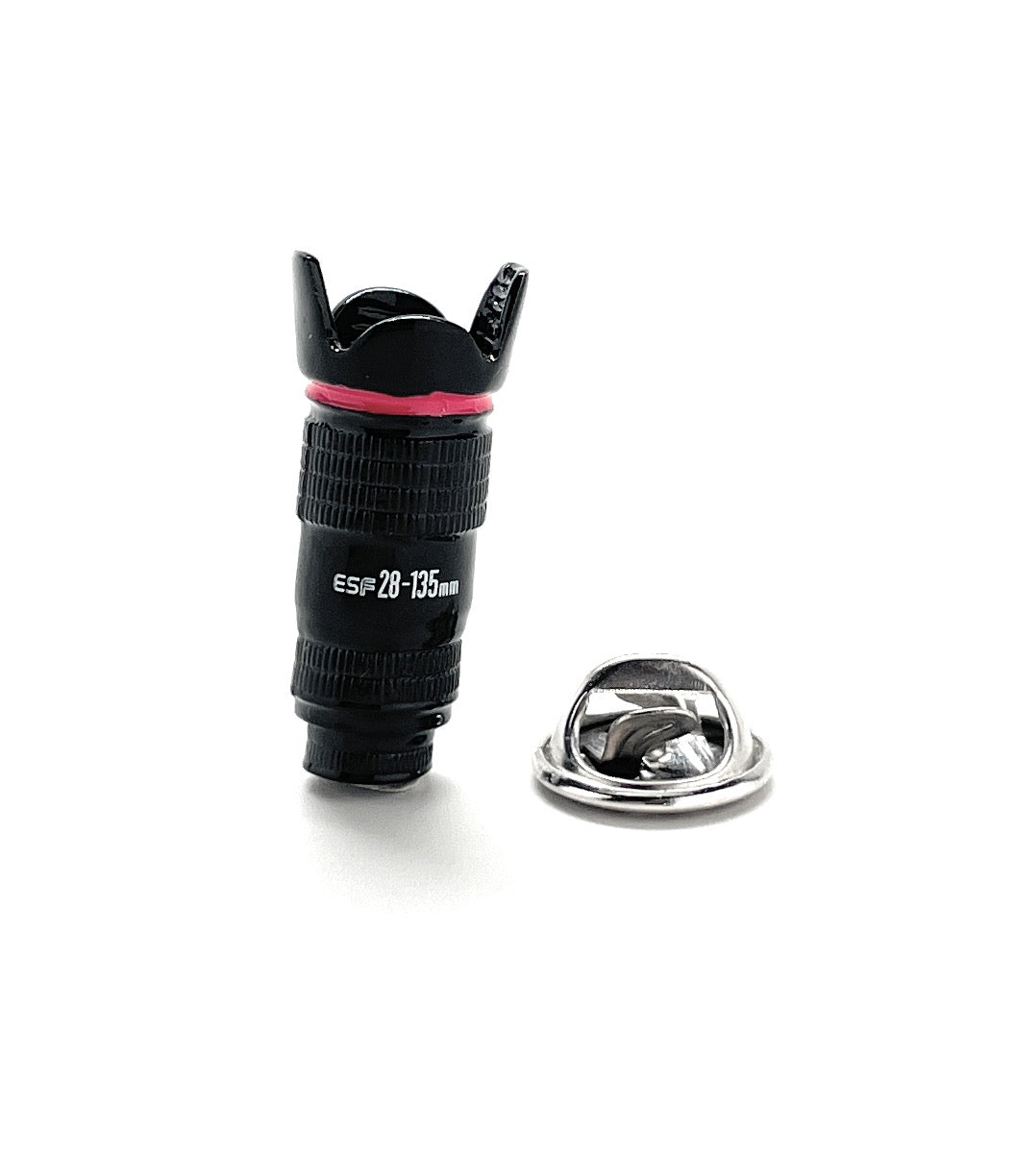 Camera lens with a pink band and metal cap on a white background