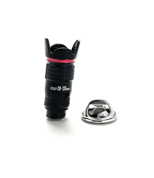 Camera lens with a pink band and metal cap on a white background