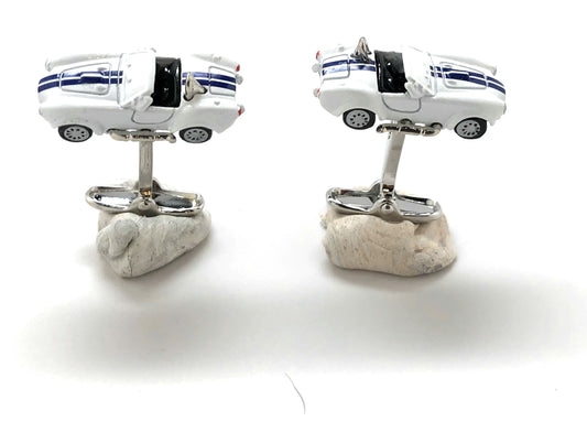 Car-shaped cufflinks on a white background