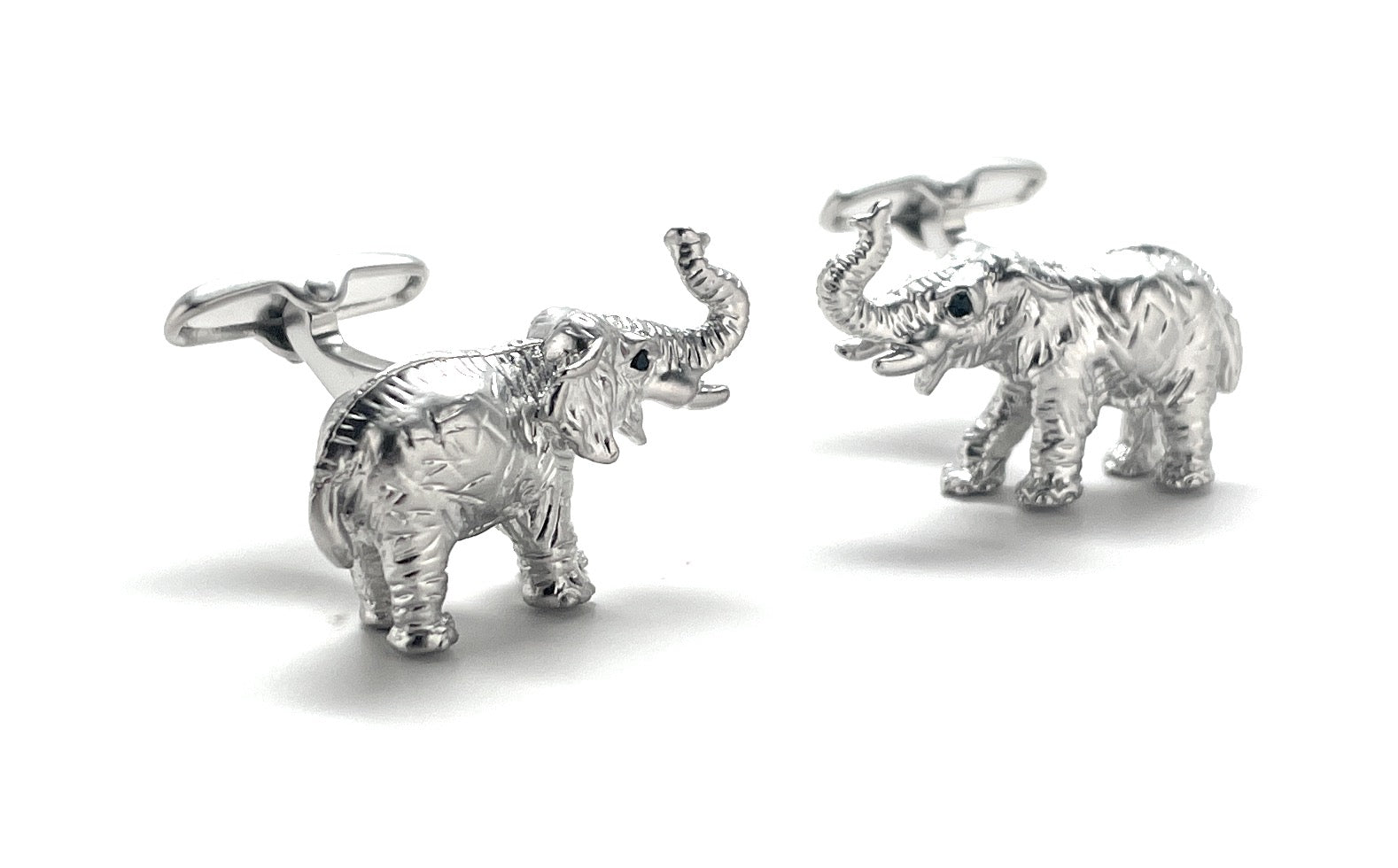 Silver elephant cufflinks on a white background