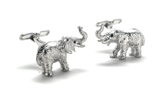 Silver elephant cufflinks on a white background