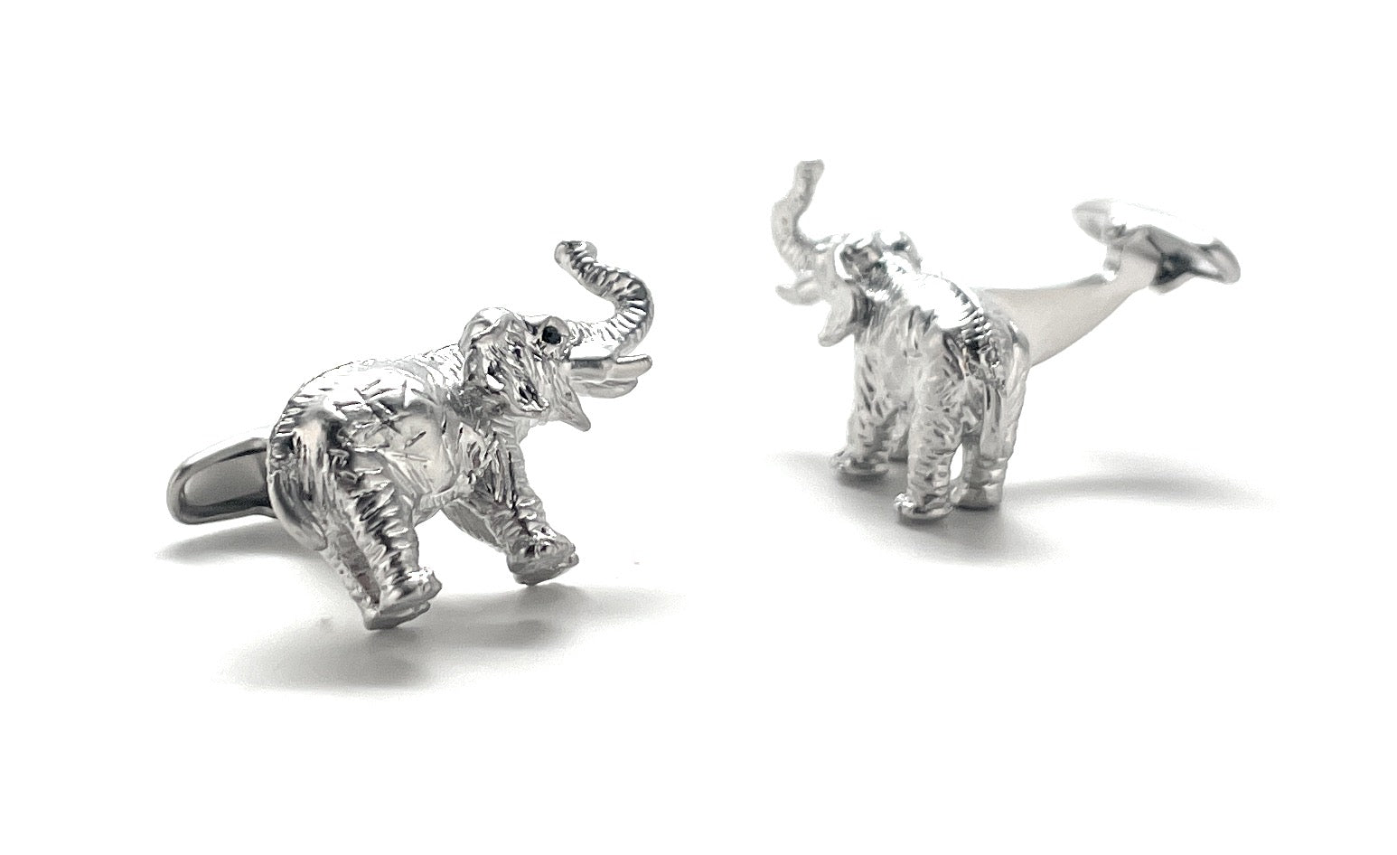 Silver elephant cufflinks on a white background
