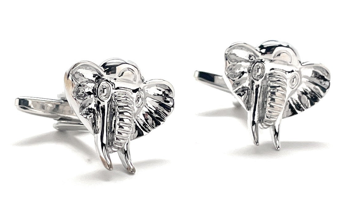 Silver elephant cufflinks on a white background