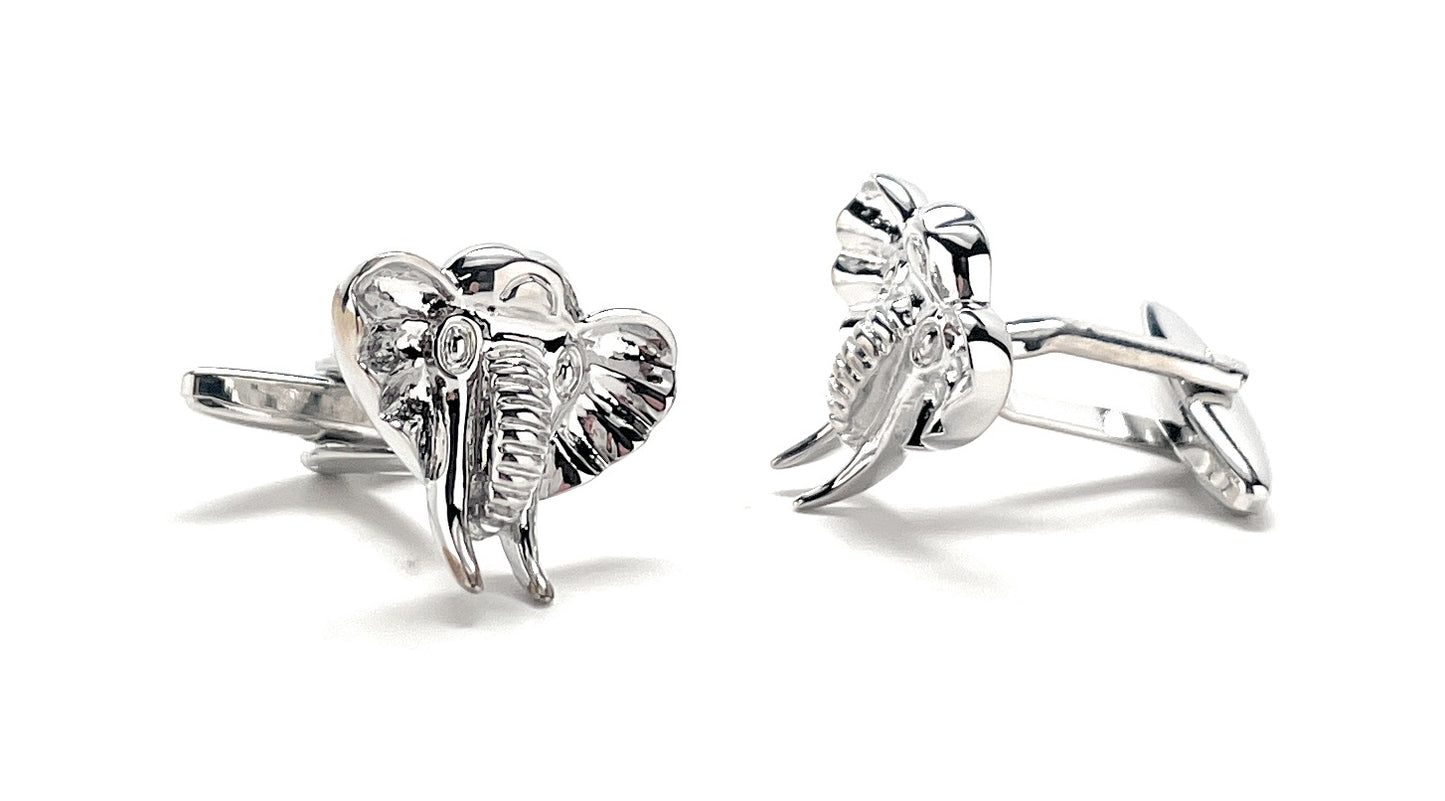 Silver elephant cufflinks on a white background