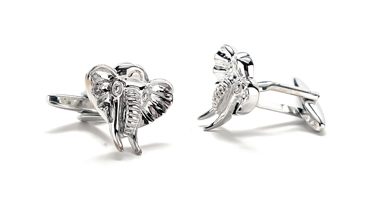 Silver elephant cufflinks on a white background