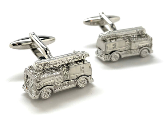 Silver fire truck cufflinks on a white background