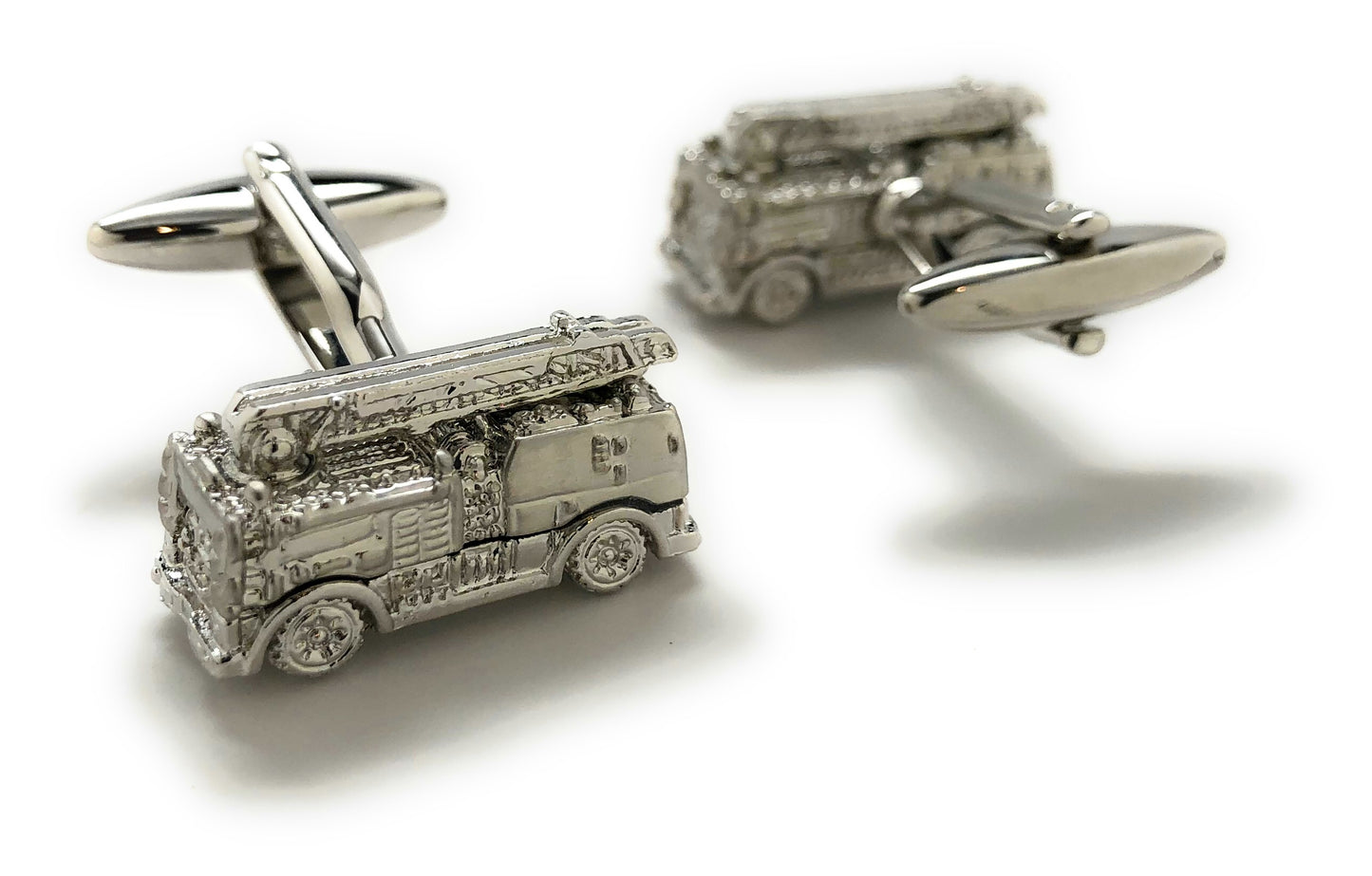 Silver fire truck cufflinks on a white background