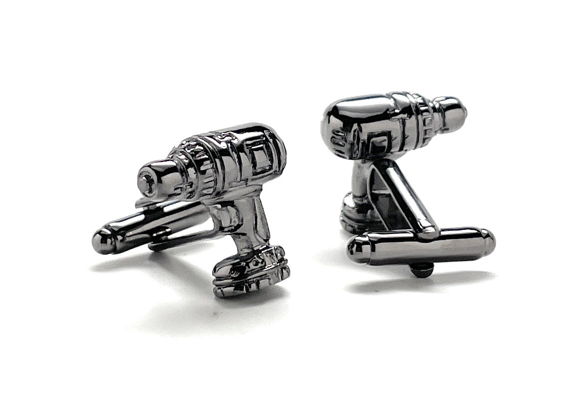 Cufflinks designed like a spaceship on a white background