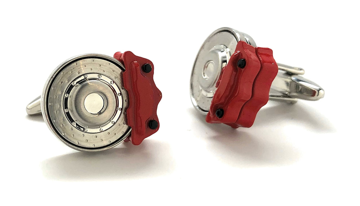 Cufflinks resembling car brake calipers with red and silver design on a white background