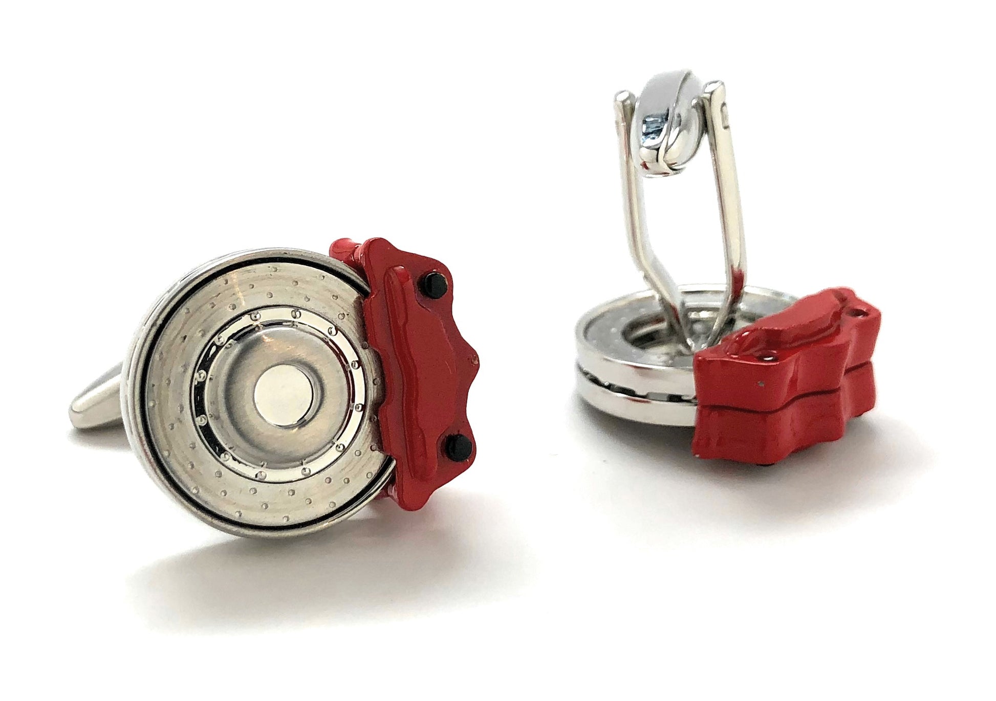 Cufflinks with red and silver design on a white background