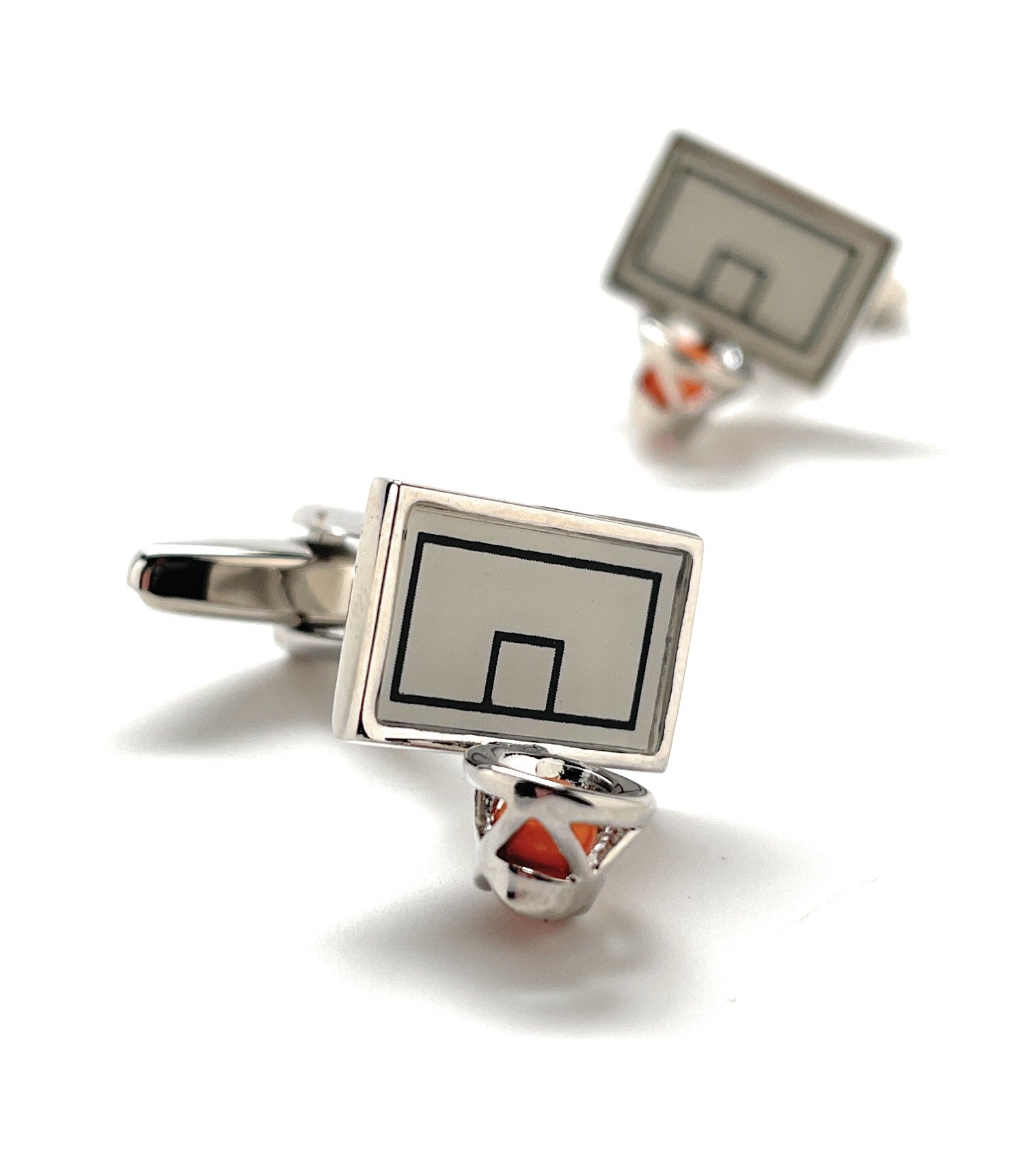 Basketball hoop cufflinks on a white background