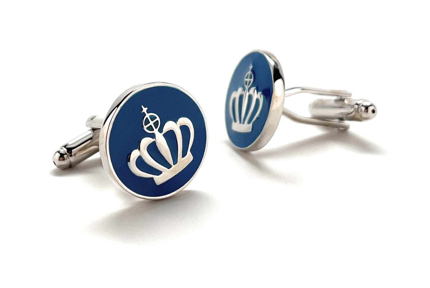 Cufflinks with a crown design on a white background