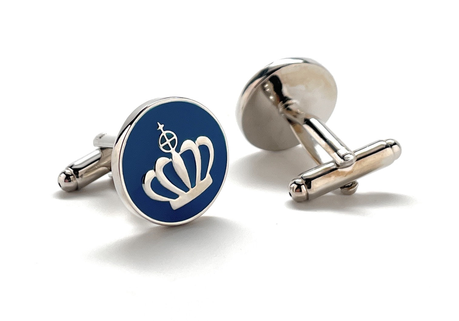 Cufflinks with a blue round emblem and silver accents on a white background