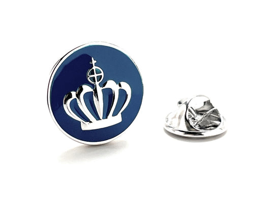 Round blue and silver lapel pin with a crown design on a white background