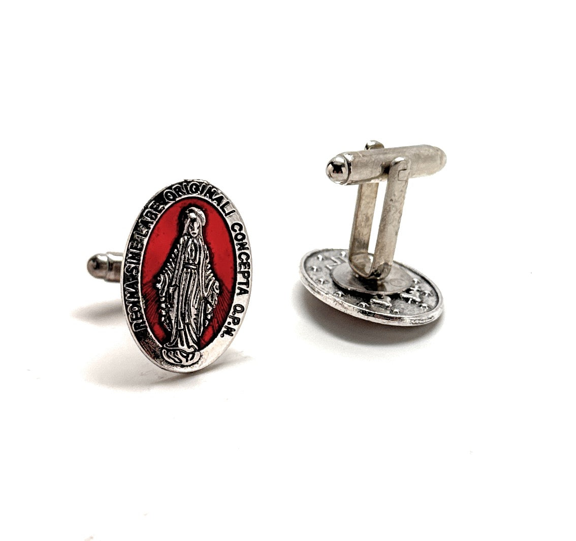 Cufflinks with religious design on a white background