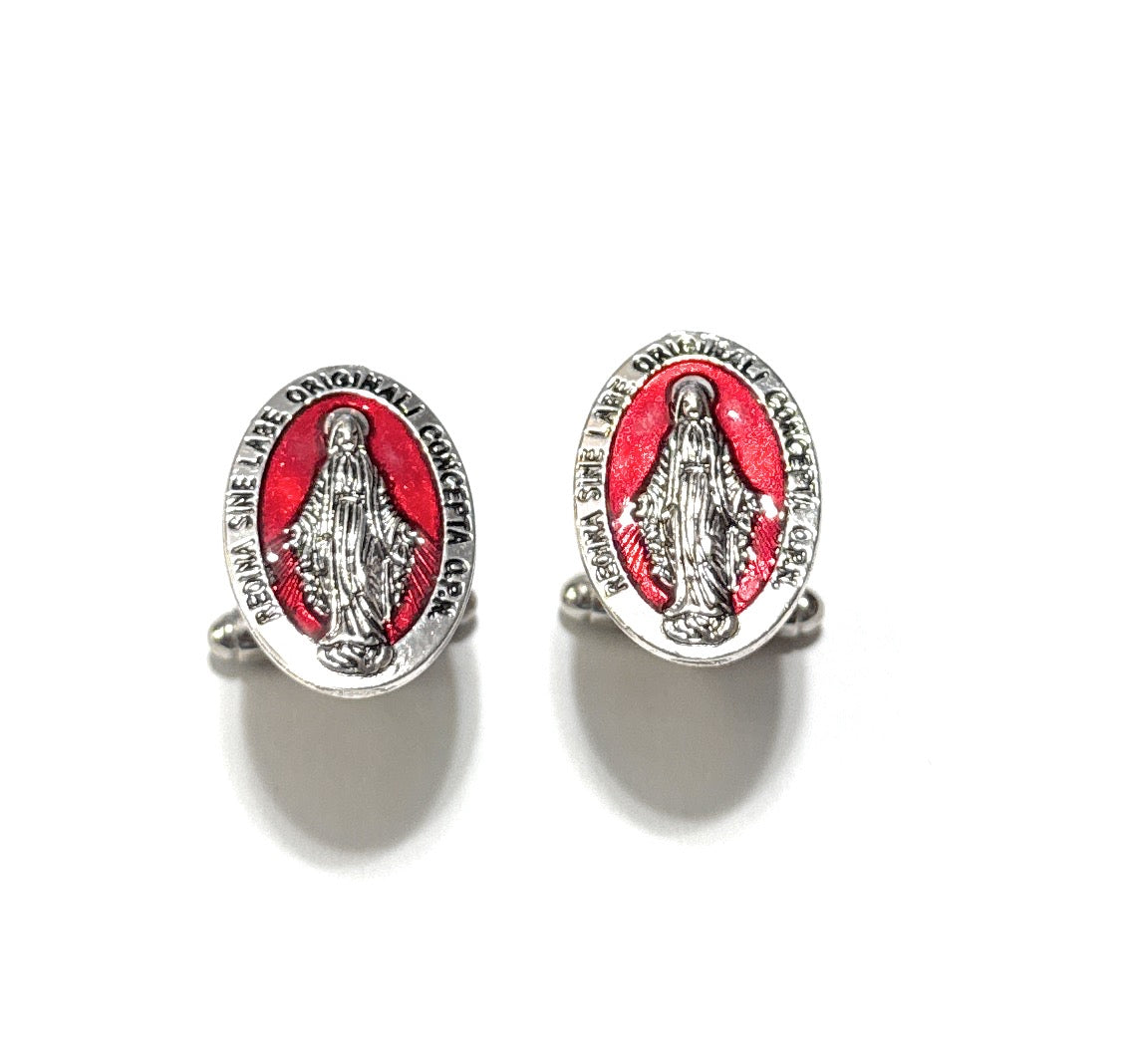 Pair of oval-shaped earrings with red center and silver border on a white background