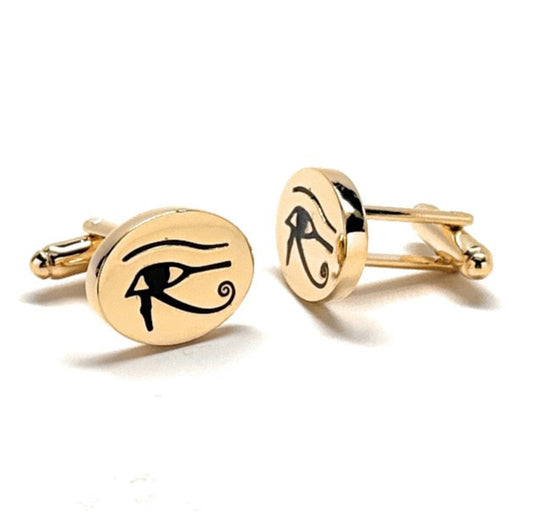 Gold cufflinks with eye symbol on a white background